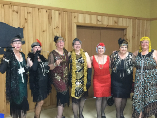 Group of women dressed in 1920's attire.